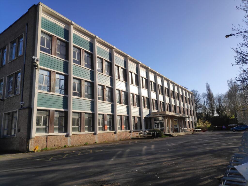 Photo of St Annes house with a blue sky behind it